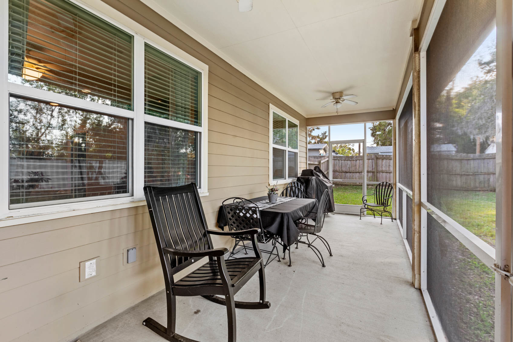 screened in patio with patio furniture